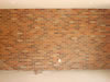 This brick facade offers interest to this interior